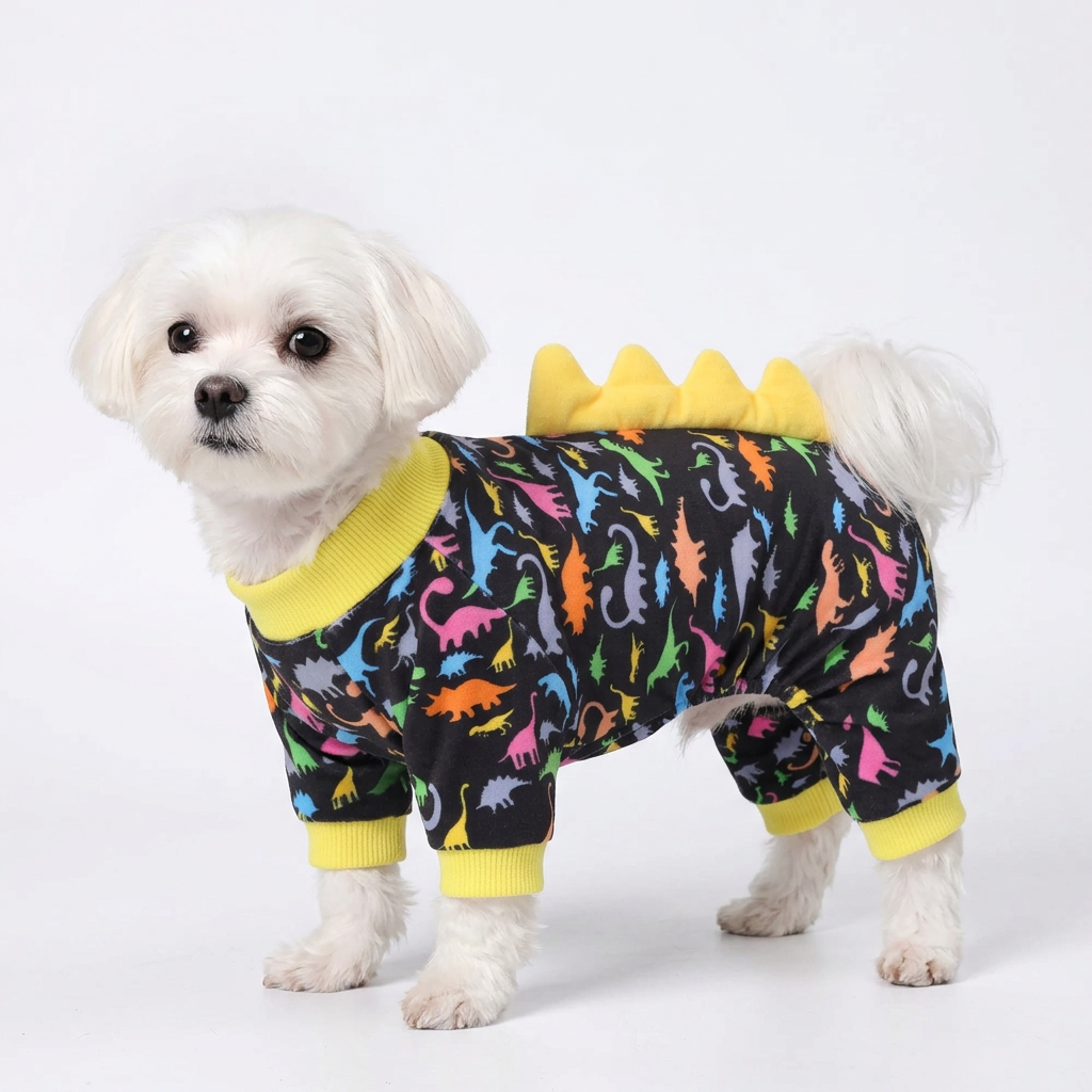 Maltese wearing black dinosaur spike dog pajamas